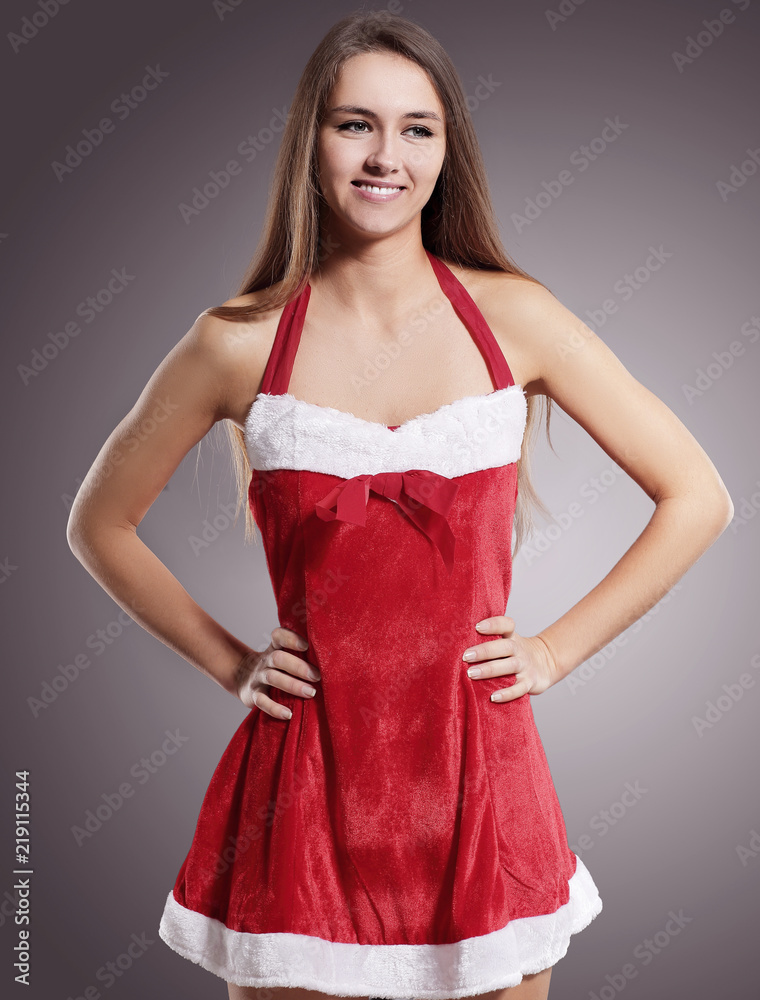 young woman in suit Santa Claus on a black background