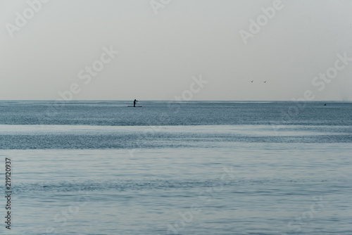 Lone paddle board on Mediterranean