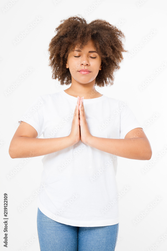 Close-up of hands of black, afro american woman in white clothes meditating indoors, focus on arms in Namaste gesture. Healthy lifestyle concept. Mock up. Copy space. Template. Blank. Close-up of hands of black, afro american woman in white clothes meditating indoors, focus on arms in Namaste gesture. Healthy lifestyle concept. Mock up. Copy space. Template. Blank.