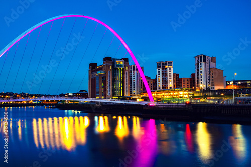 Illuminated landmarks with river Tyne in Newcastle, UK
