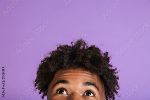 Fotografi Half face portrait of a young afro american man isolated