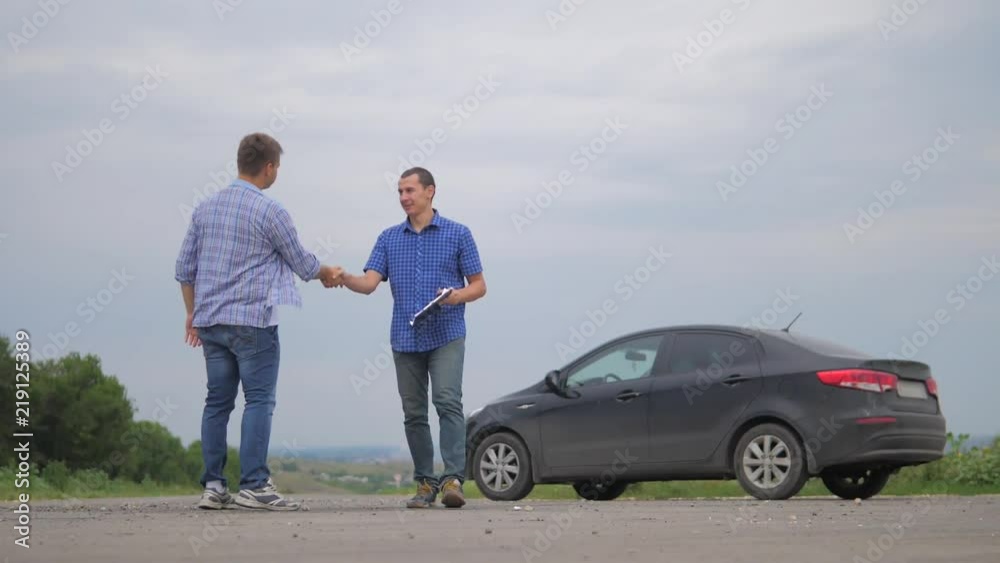 On the road car accident insurance agent examining carcrash owner and insurance staff make paper form. two men make a deal lifestyle. man seller driver makes car the auto insurance slow motion video On the road car accident insurance agent examining carcrash owner and insurance staff make paper form. two men make a deal lifestyle. man seller driver makes car the auto insurance slow motion video