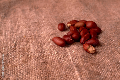 peanut hill Deep fried peanuts over rustic wicker background. emptiness place. Space for text. copyspace photo