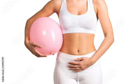 Woman holding a balloon, feeling bloated concept   photo