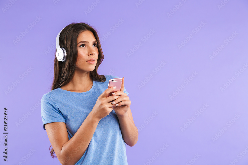 Portrait of a pretty young girl holding mobile phone Portrait of a pretty young girl holding mobile phone