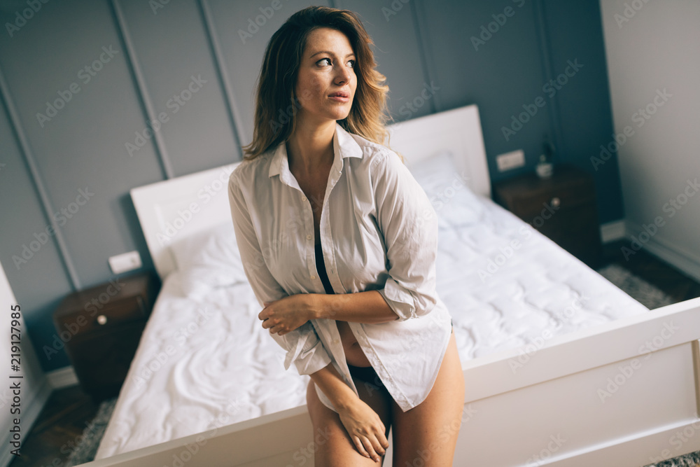 Picture of happy attractive woman in bedroom Picture of happy attractive woman in bedroom