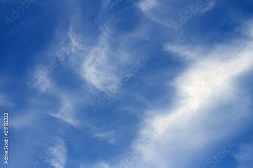 Sky clouds background. Spindrift white clouds in the blue sky in the morning