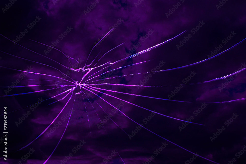 cracks on the glass on a textured background cracks on the glass on a textured background