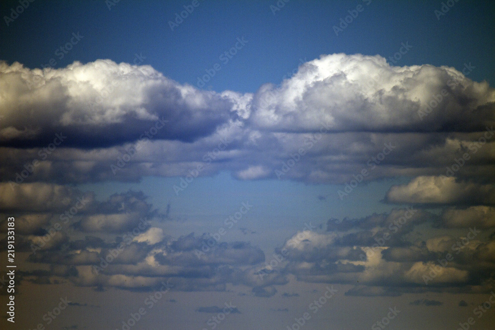 Sky clouds background. Cumulus white clouds in the dark blue sky in the morning