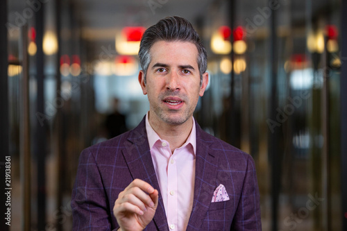 Caucasian New York City Man Works In His Office While Wearing A Purple Suit photo