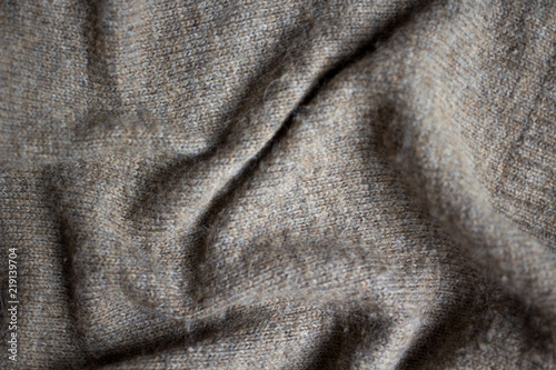 the texture of a knitted sweater, close up warm woollen clothing