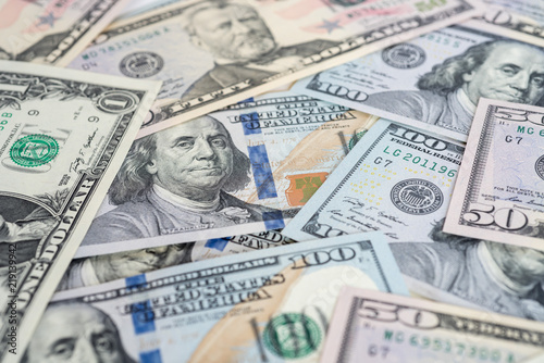 Scattered US currency banknotes