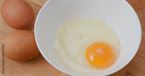 Breaking egg in bowl