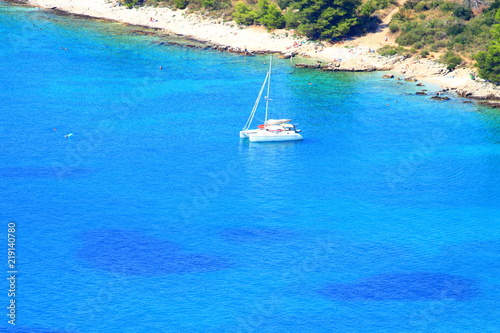 Beautiful blue Adriatic sea and rocky beach near Primosten, Croatia