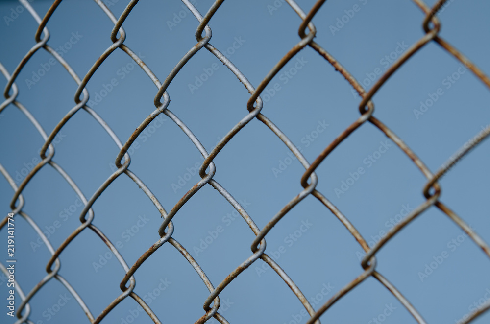 Rust iron net on blue backgound