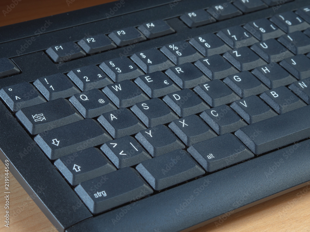 German black computer keyboard with a blank key