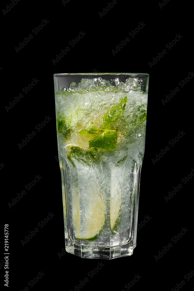 Summer drink with lime and mint, ice on isolated black background. Direct perspective, cool, refreshing Summer drink with lime and mint, ice on isolated black background. Direct perspective, cool, refreshing