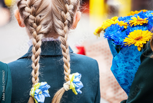 Bouquets of flowers in hands of children photo