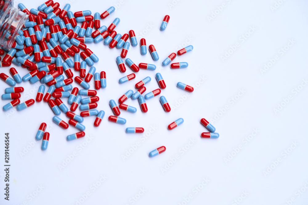 Closeup of drug capsules from the bottle on white background. Closeup of drug capsules from the bottle on white background.