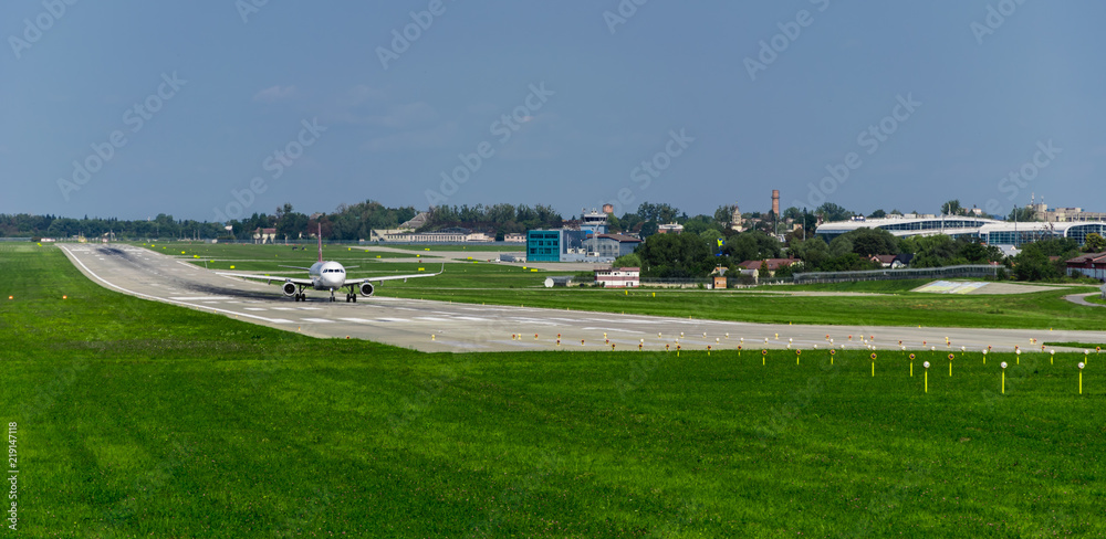 airplane on runway, green grass, blue sky airplane on runway, green grass, blue sky