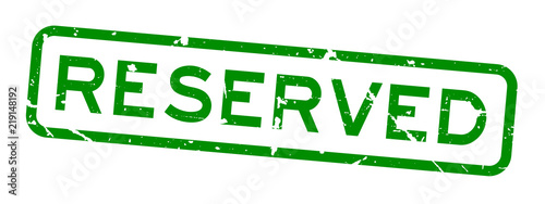 Grunge green reserved wording square rubber seal stamp on white background
