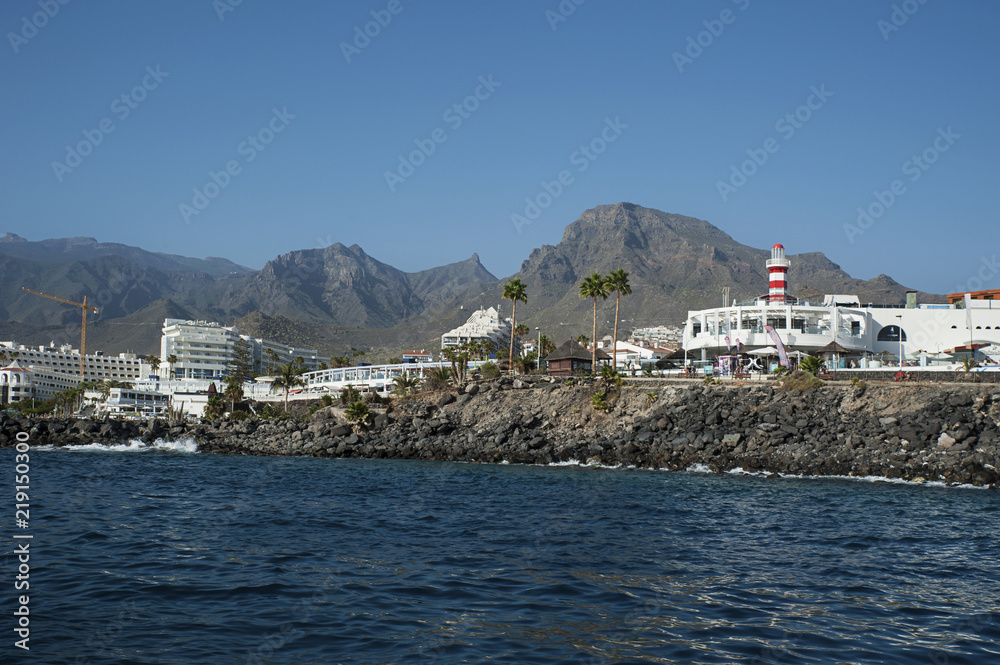 View from the ocean of the popular resort of Las Americas for its port restaurants, pubs and bars, entertainment and night life venues in the south of Tenerife, Costa Adeje, Canary Islands, Spain