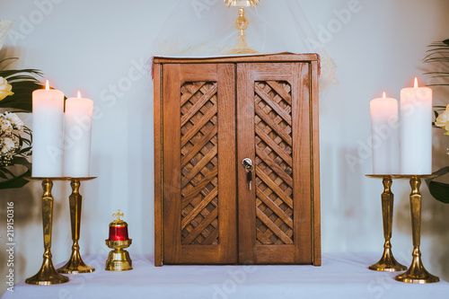 Wooden box with holy eucharist in church during christmas fasting
