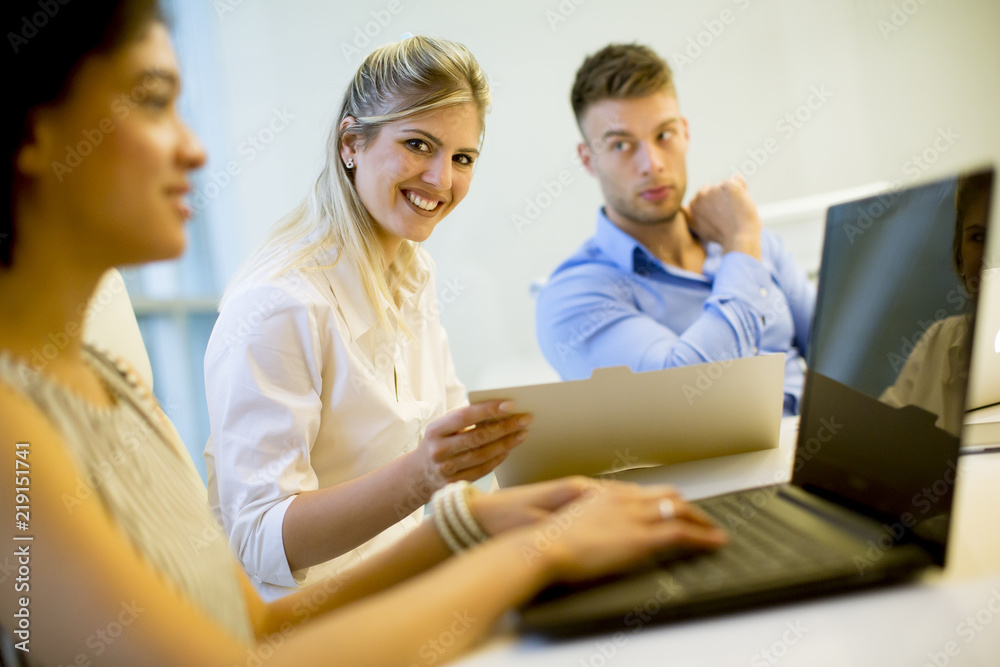 Young multiracial people working in the modern office Young multiracial people working in the modern office