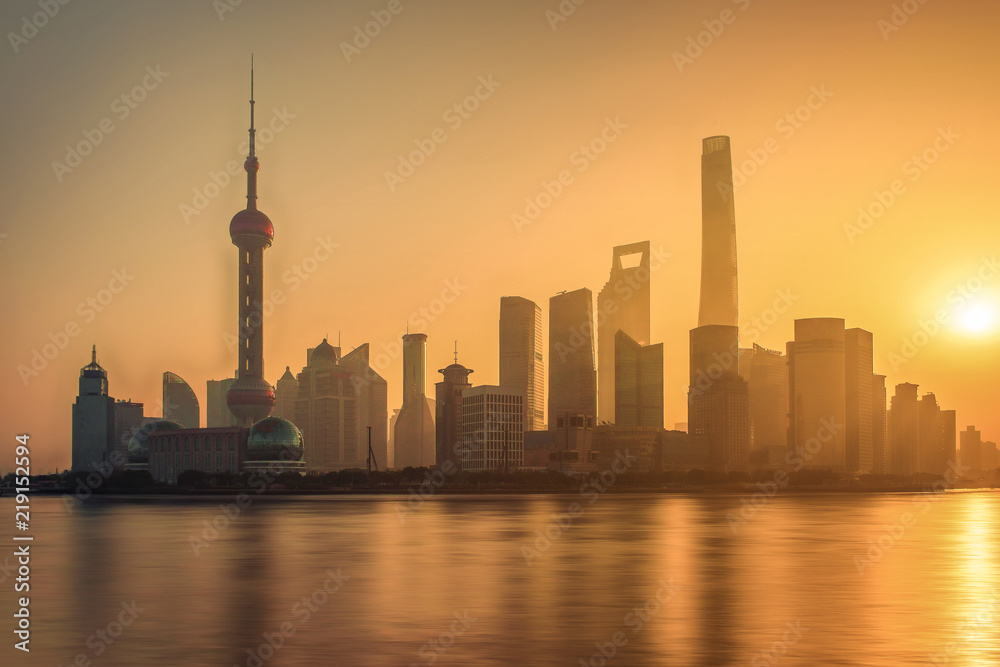 Moring view of shanghai skyline and huangpu river with sunrise glow