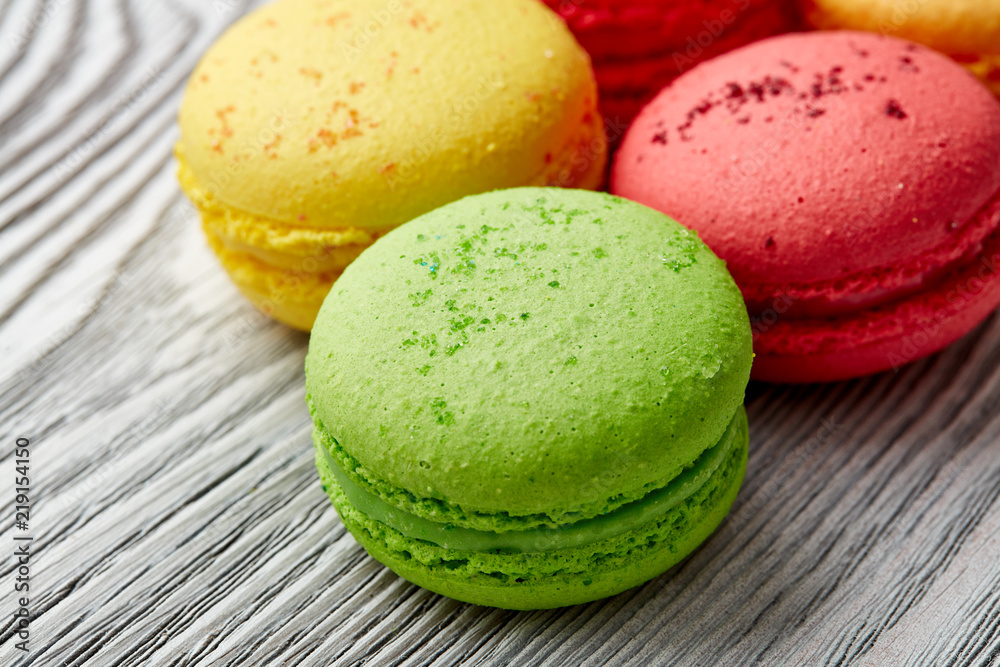 colorful macarons over wood table. top view colorful macarons over wood table. top view