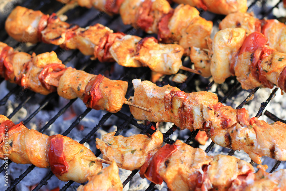 meat kebabs cooking on the barbecue