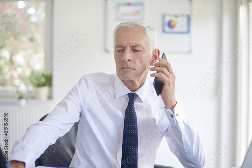 Businessman using his mobile phone