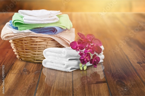 Fototapeta Naklejka Na Ścianę i Meble -  Laundry Basket with colorful towels on desk