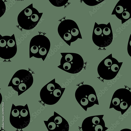 Vector illustration. Seamless cute pattern. Owls on the khaki background.