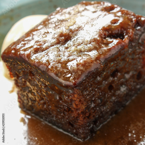 plated sticky toffee pudding dessert photo