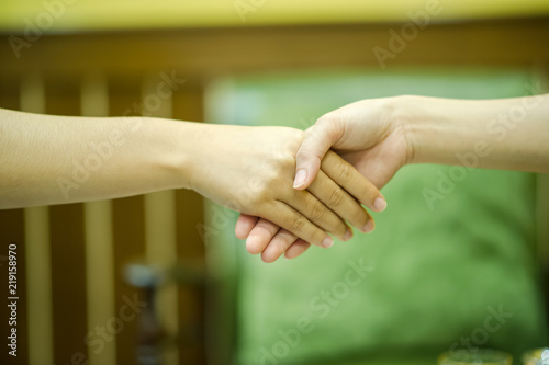 Join the hands of two people. And the greeting of friends. Communicate in team and teamwork. Teamwork concept