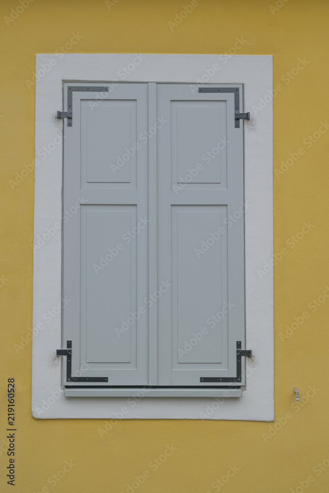 A colorful closed house window in the old town of Rudesheim, Germany A colorful closed house window in the old town of Rudesheim, Germany