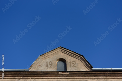 Old roof in Riga, Latvia with signature 1912 photo