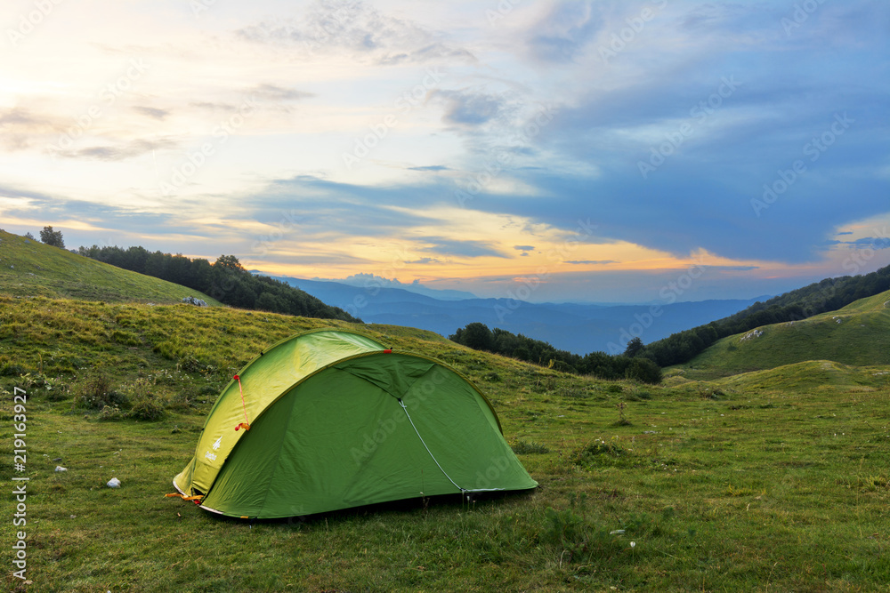 A Camping Tent on the base camp - Adventure moment with a beautiful Sunrise - Background of Corno Piccolo and Corno Grande