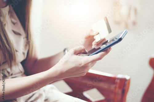 woman asian using phone and credit card shopping online   selective focus on hand
