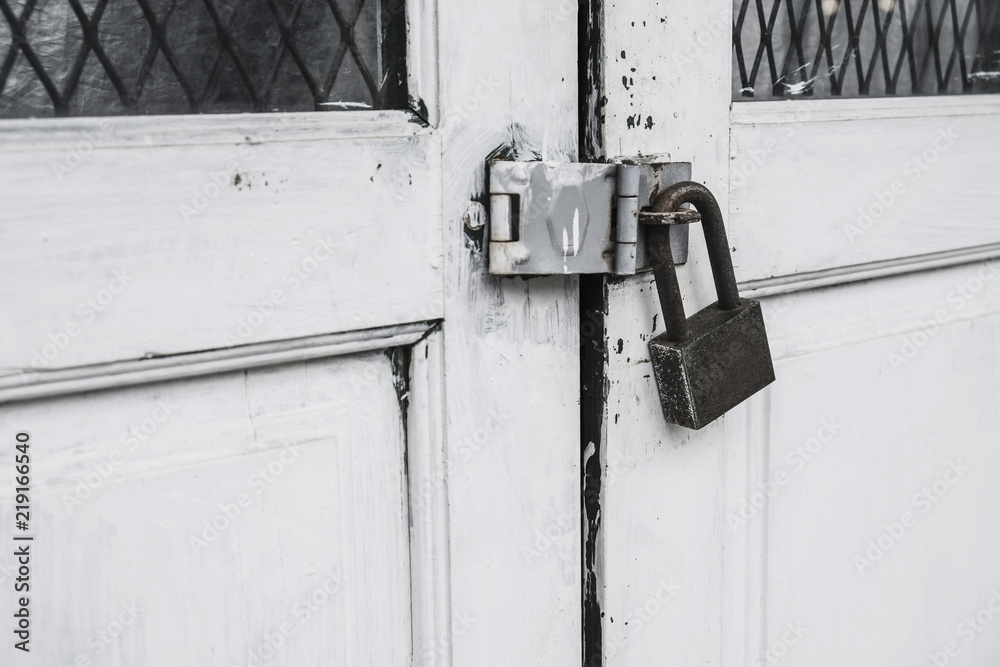 Old master key at white wooden door Old master key at white wooden door