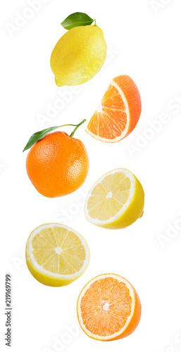 Flying orange and lemon isolated on white background