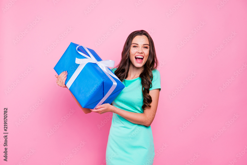 Portrait of charming, lovely, cute brunette with long hair holds Portrait of charming, lovely, cute brunette with long hair holds