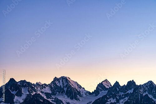 Scenic view of beautiful Swiss Alps mountains. Blue hour sunset with pink and blue tones, Verbier, Canton du Valais, Wallis, Switzerland. © 1tomm