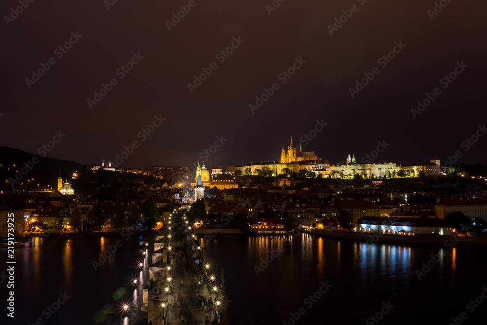 Night scenery of top view over Charles Bridge, old iconic historical across Vltava river from Old Town Bridge Tower in Prague,  Czech Republic
