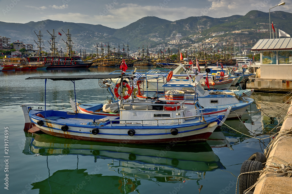 Port in Alanya, Turkey, in the foreground small fishing boats