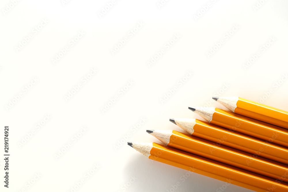 Obraz premium Yellow orange school homework pencils on white background