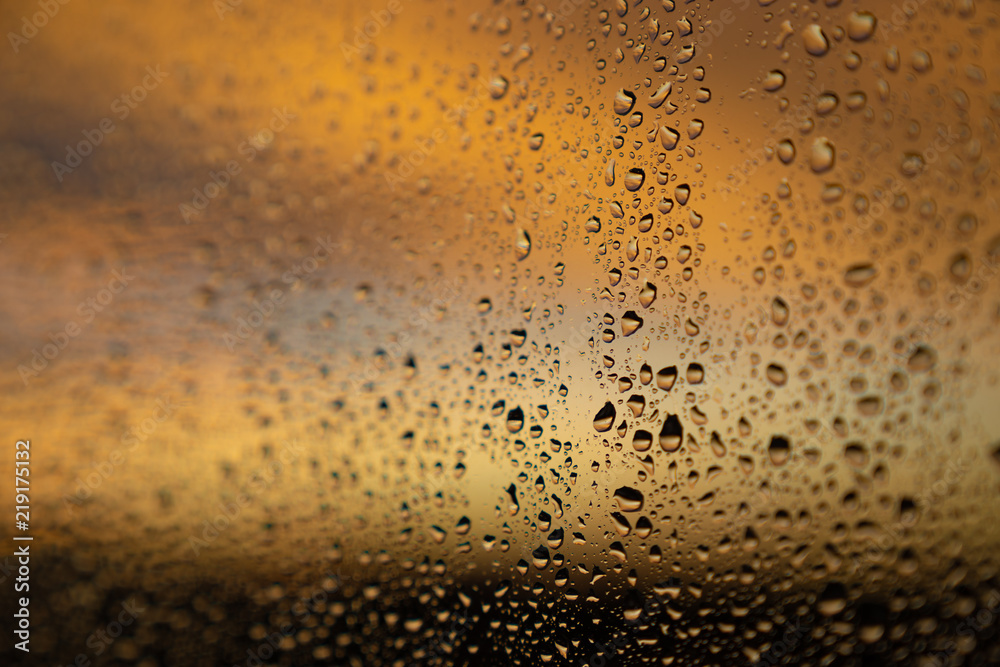 closeup of raindops on window in the evening