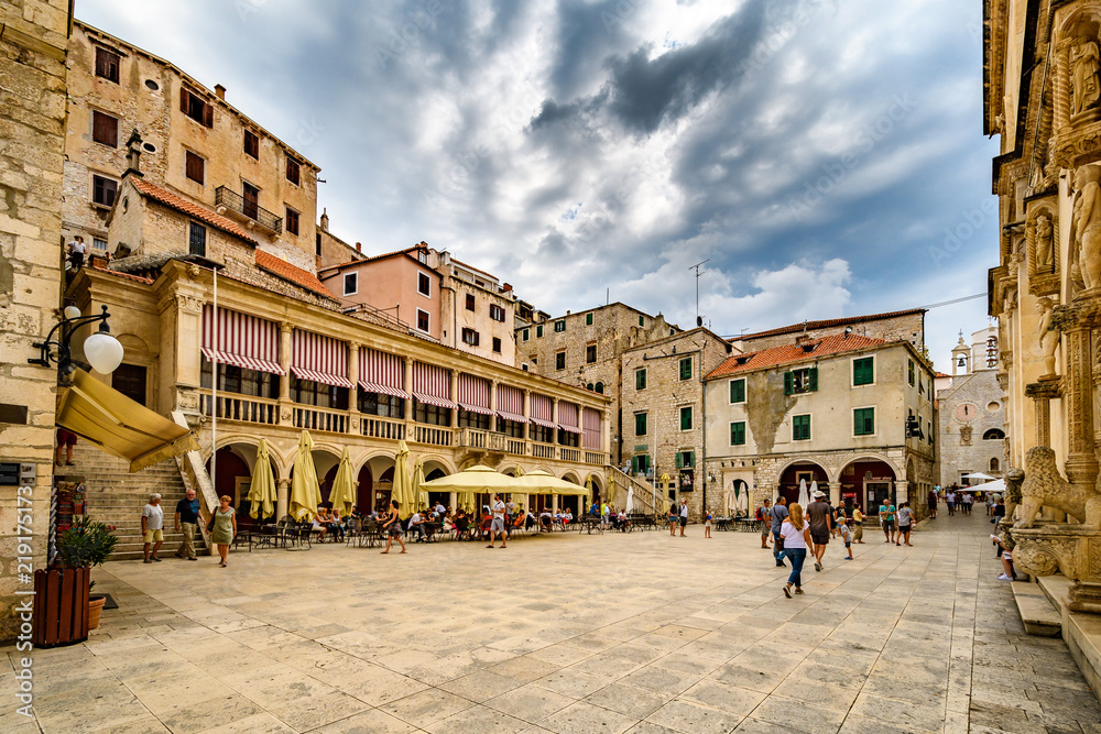 old square with clouds and ancient buildings