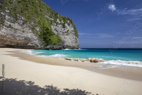 Interesting shadows and white sand at Kelingking Beach on Nusa Penida in Indonesia.